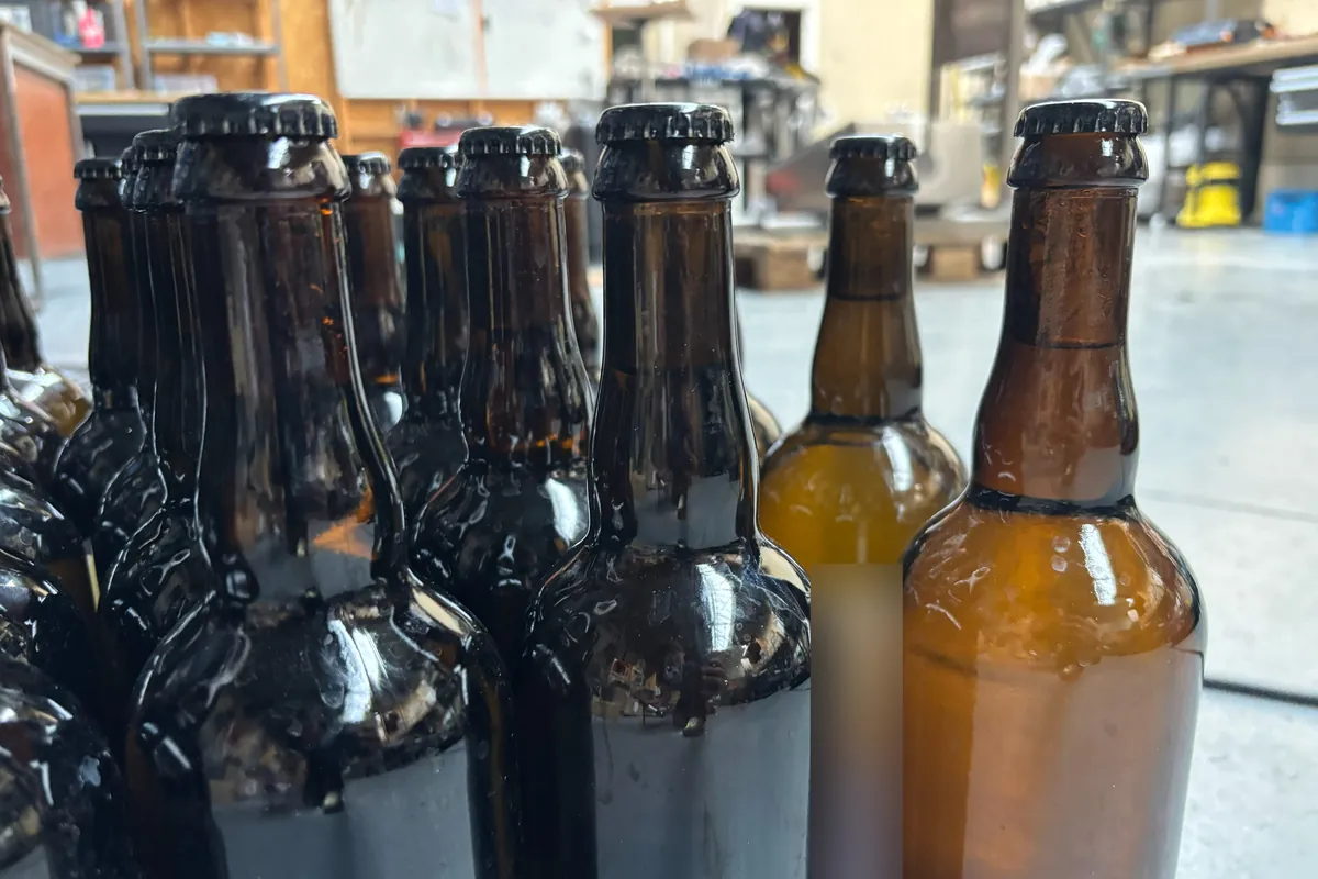 750ml bottles after a format change, filled to a consistent height in the fill-level test