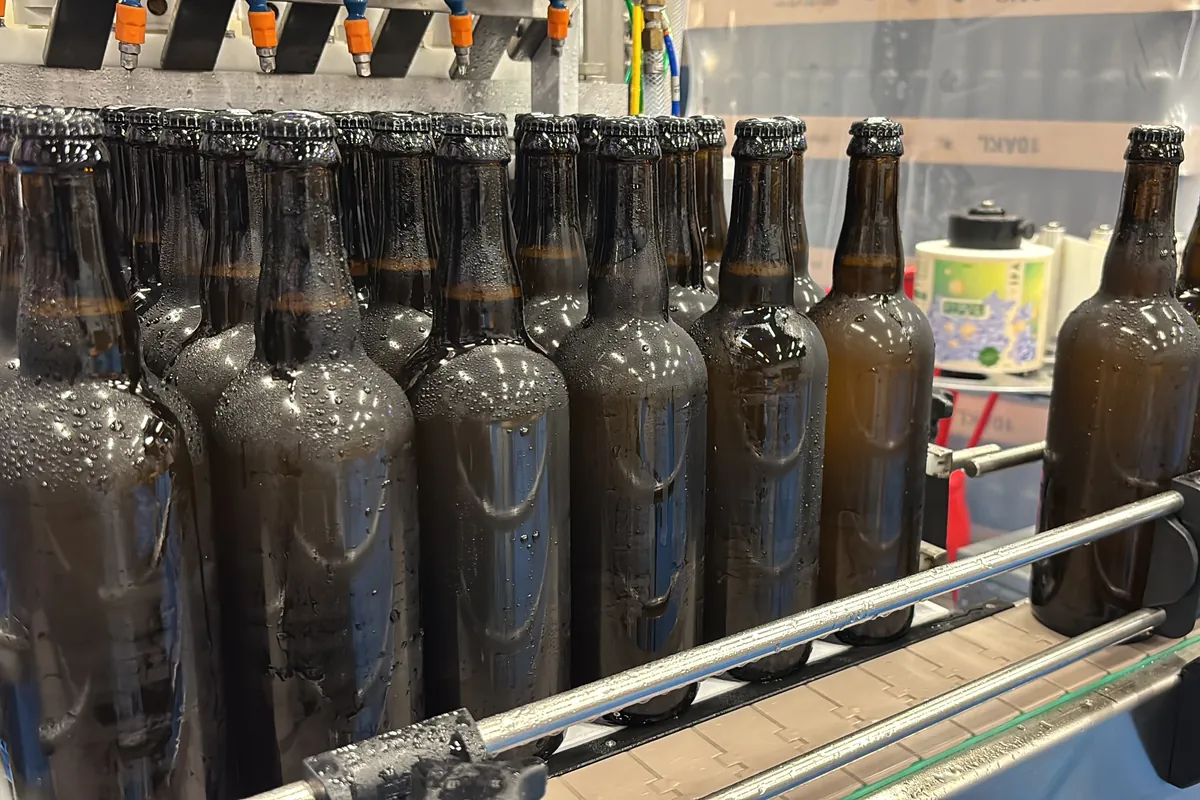 A Meheen bottling machine set up to run a 750ml bottle