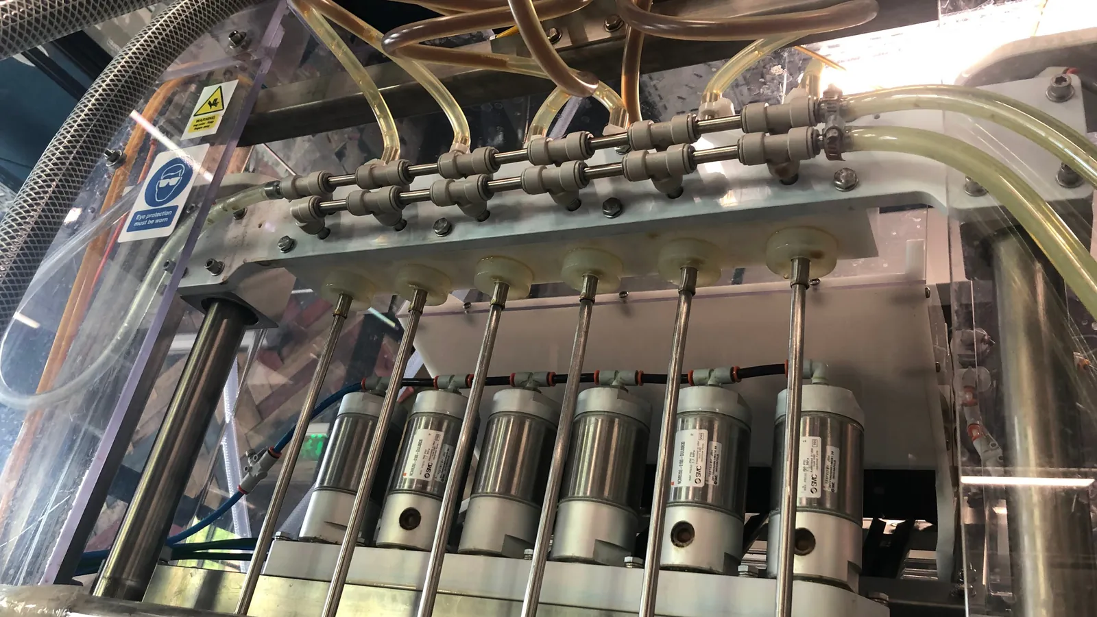 A Meheen bottling machine set up to run a bottle format